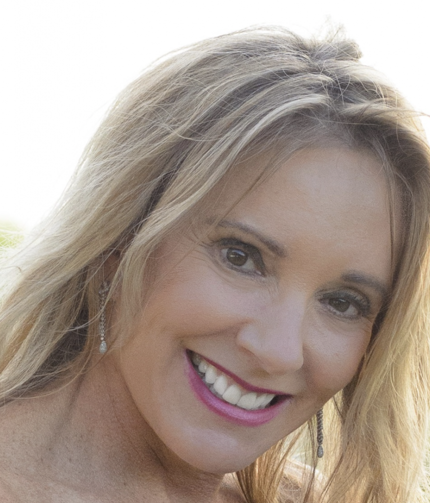 Woman smiles warmly.